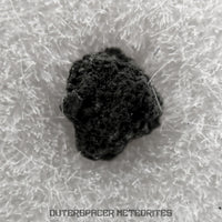 Winchcombe - CM2 Carbonaceous Chondrite - Fragment - 0.011 g - England (Gloucestershire)